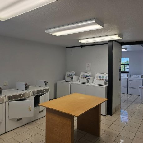 Laundry area with a large number of machines to wash clothes